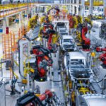 Assembly line production of new car. Automated welding of car body on production line. robotic arm on car production line is working