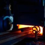 Close up of various pieces of iron heating inside forge furnace. Burning fire with steel. Preparation of metal for processing.