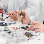men-lab-doing-experiments-close-up